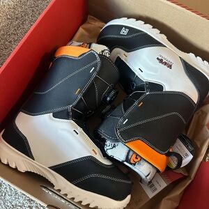 Black and White NITRO Snowboard Boots with Orange Accents